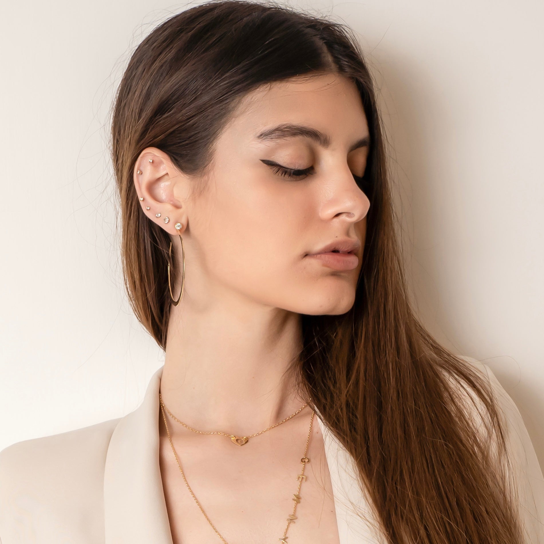 Necklace with heart and perforated letter